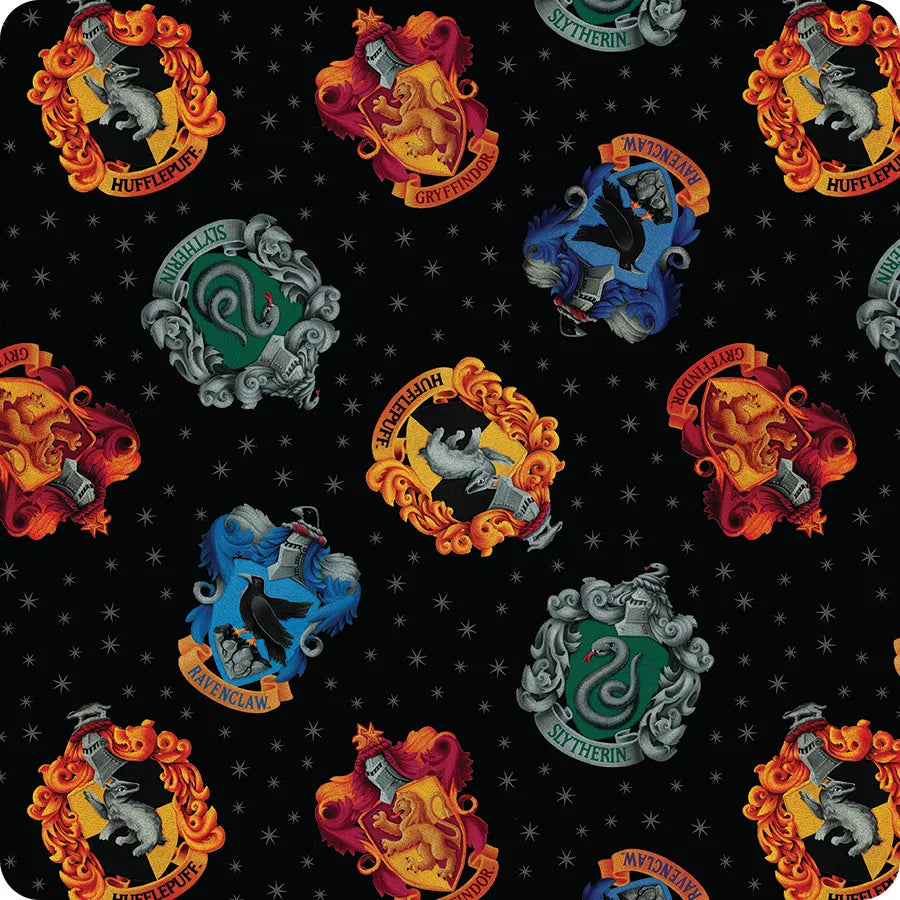 The Benartex Harry Potter Black House Crests 108" Wide 3 Yard Quilt Fabric Back Pack features colorful Gryffindor, Hufflepuff, Ravenclaw, and Slytherin crests on black—ideal for quilts or wide quilt backings.