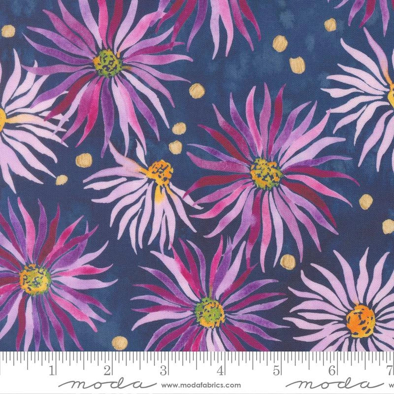 Soulstice Wall Flower Navy Fabric Yardage by United Notions features large pink and purple daisy-like flowers with yellow centers and small yellow dots on dark blue quilting cotton. Ruler in image displays scale in inches and centimeters.
