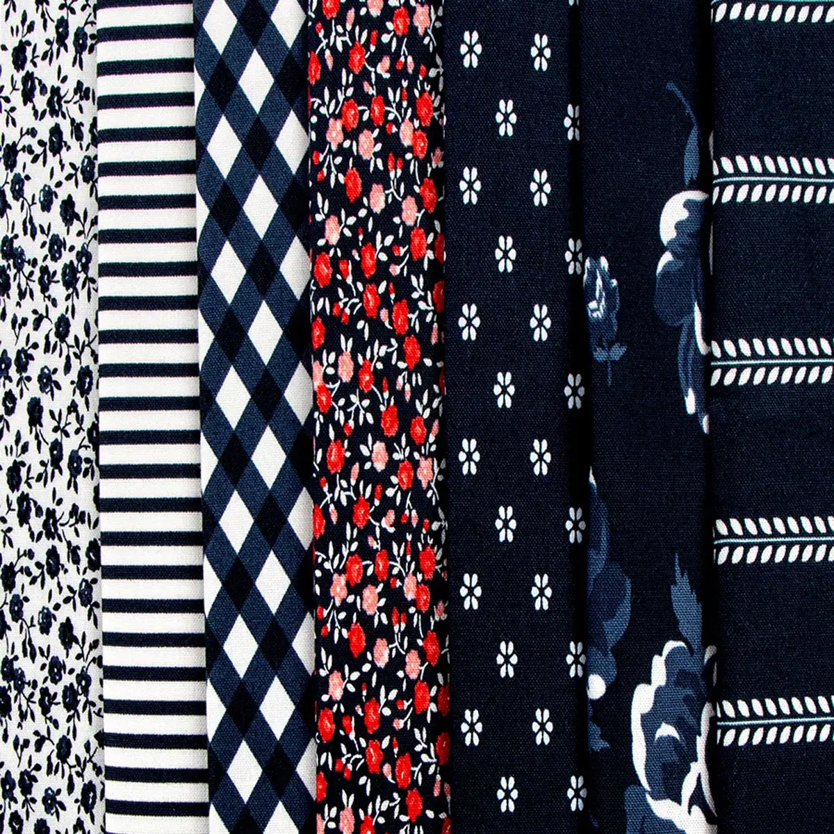 Seven 10" fabric squares from the Summertime Layer Cake are displayed vertically, each featuring unique black, white, or red floral and geometric patterns like florals, stripes, checks, and dots.