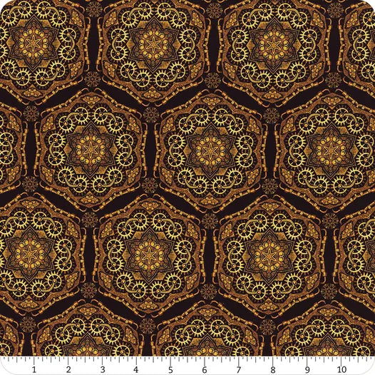 Steampunk Menagerie Gold Gear Stars Fabric Yardage by In the Beginning Fabrics features golden gears and mandala patterns on a dark background, with a ruler in inches at the bottom to indicate design size and scale.