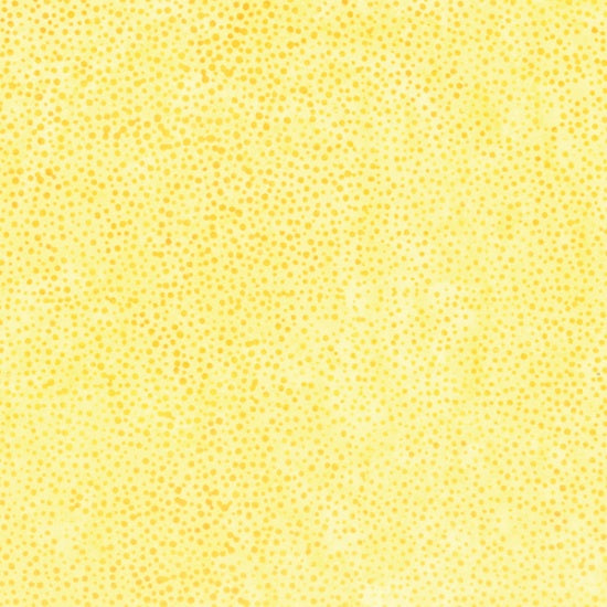 Dot Sun Batik Fabric Yardage features a yellow background with small, scattered yellow dots in varying shades for a textured, speckled look reminiscent of traditional Batik designs.