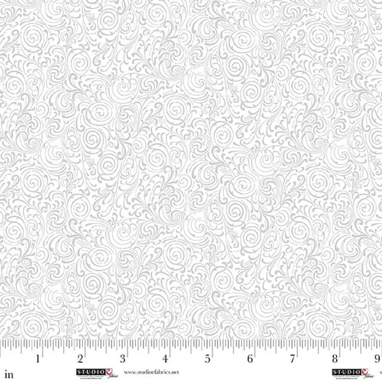 Best of Cream & Sugar White on White Double Swirls Fabric Yardage by Jaftex - Studio E features a subtle light gray swirling vine and leaf pattern. Ideal quilting cotton, shown with inch ruler for scale.