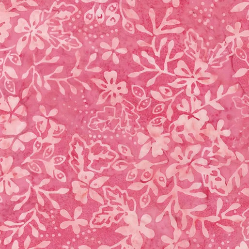 The Floral Sprigs Watermelon Fabric Yardage features a pink and white floral batik design with leaves and flowers on a textured pink background, ideal for decorative fabric projects.