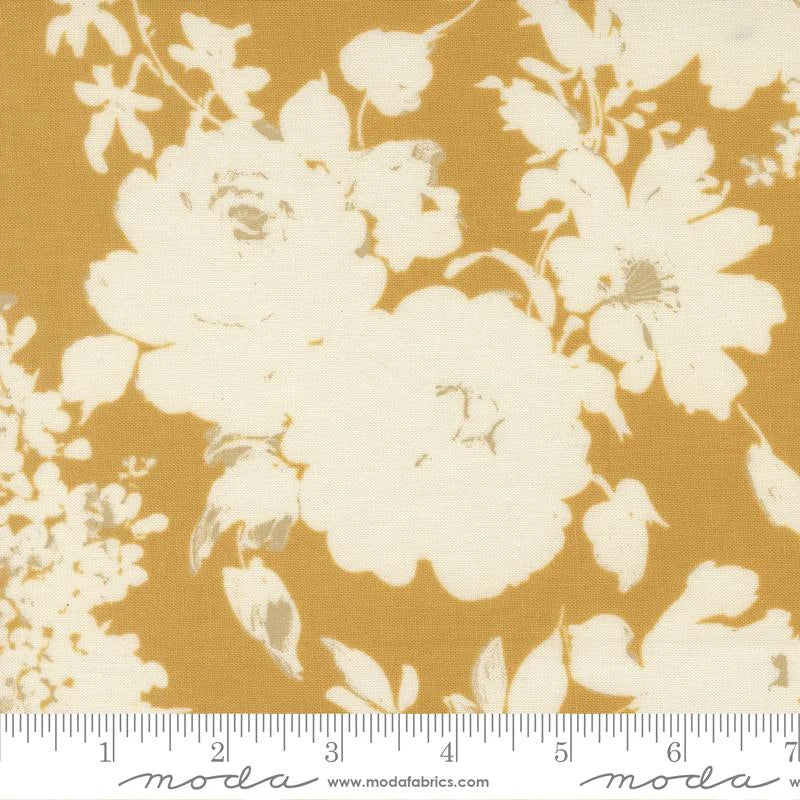 Arabesque Honey 108" Wide 3 Yard Quilt Fabric Back Pack by United Notions: golden yellow backing with off-white floral roses and leaves. Includes a ruler from 0 to 8 inches along the bottom edge for scale.