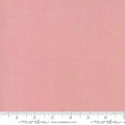 A square piece of French General Pale Rose Solid Fabric Yardage by United Notions, shown with a white inch-marked ruler along the bottom edge.
