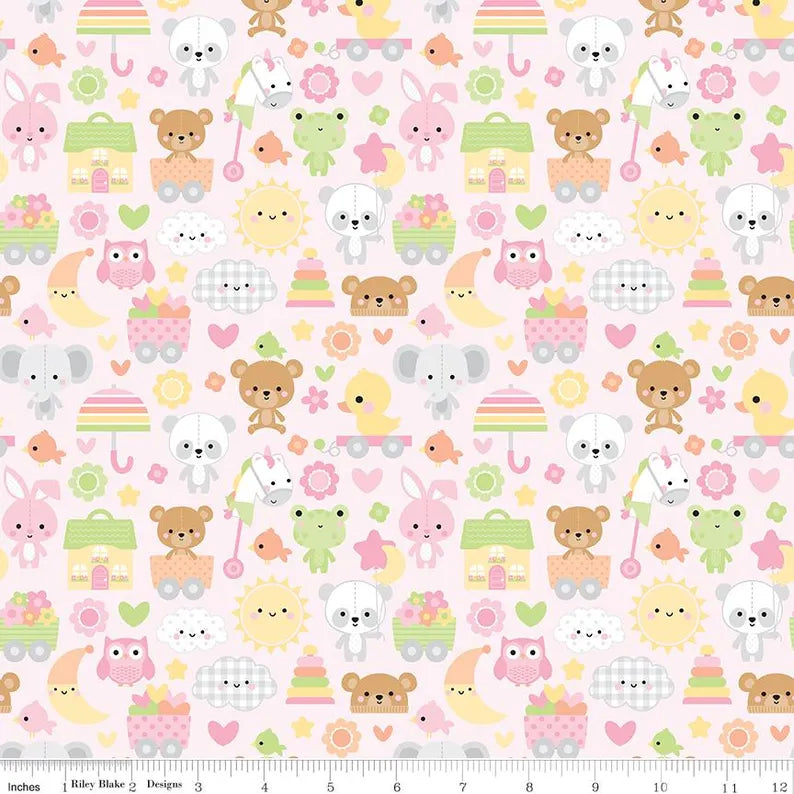 Bundle of Joy Pink Main Fabric Yardage by Doodlebug Design Inc. features adorable pastel cartoon animals, suns, cupcakes, and rainbows—perfect for baby-themed projects. Includes a ruler along the bottom edge for easy measuring.
