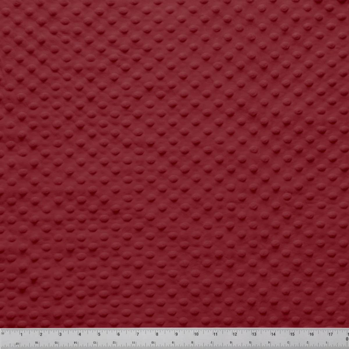 Jaftex - Henry Glass Fabrics Minky Dots Burgundy 60" Wide Quilt Backing Fabric features a soft, raised dotted texture. A ruler in the image shows inch measurements for scale of this cozy minky dot cuddle fabric.