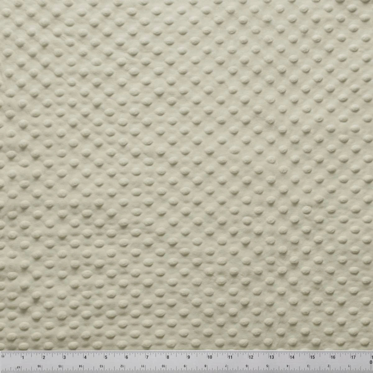 Minky Dots Latte 60" Wide Quilt Backing Fabric by Jaftex - Henry Glass Fabrics features a cream color with a raised dotted texture, perfect for baby blankets or soft quilt backing. A ruler in inches shows the scale for detailed projects.