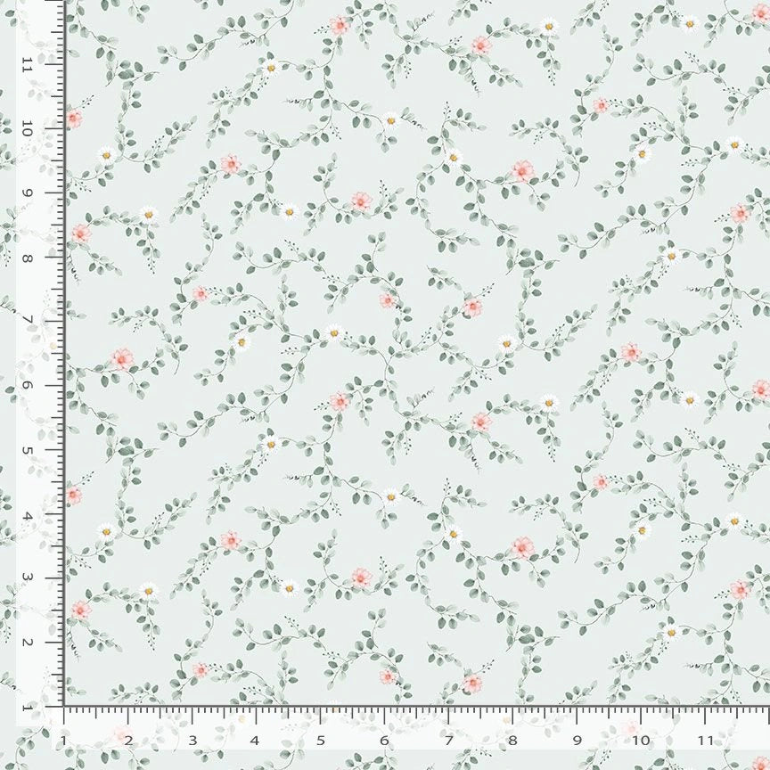 'Til the Cows Come Home Blue Tiny Floral Vines Fabric Yardage by Timeless Treasures features a pale blue background with small pink roses, white daisies, and green leafy vines. The repeating floral vine pattern is about 12 inches across.