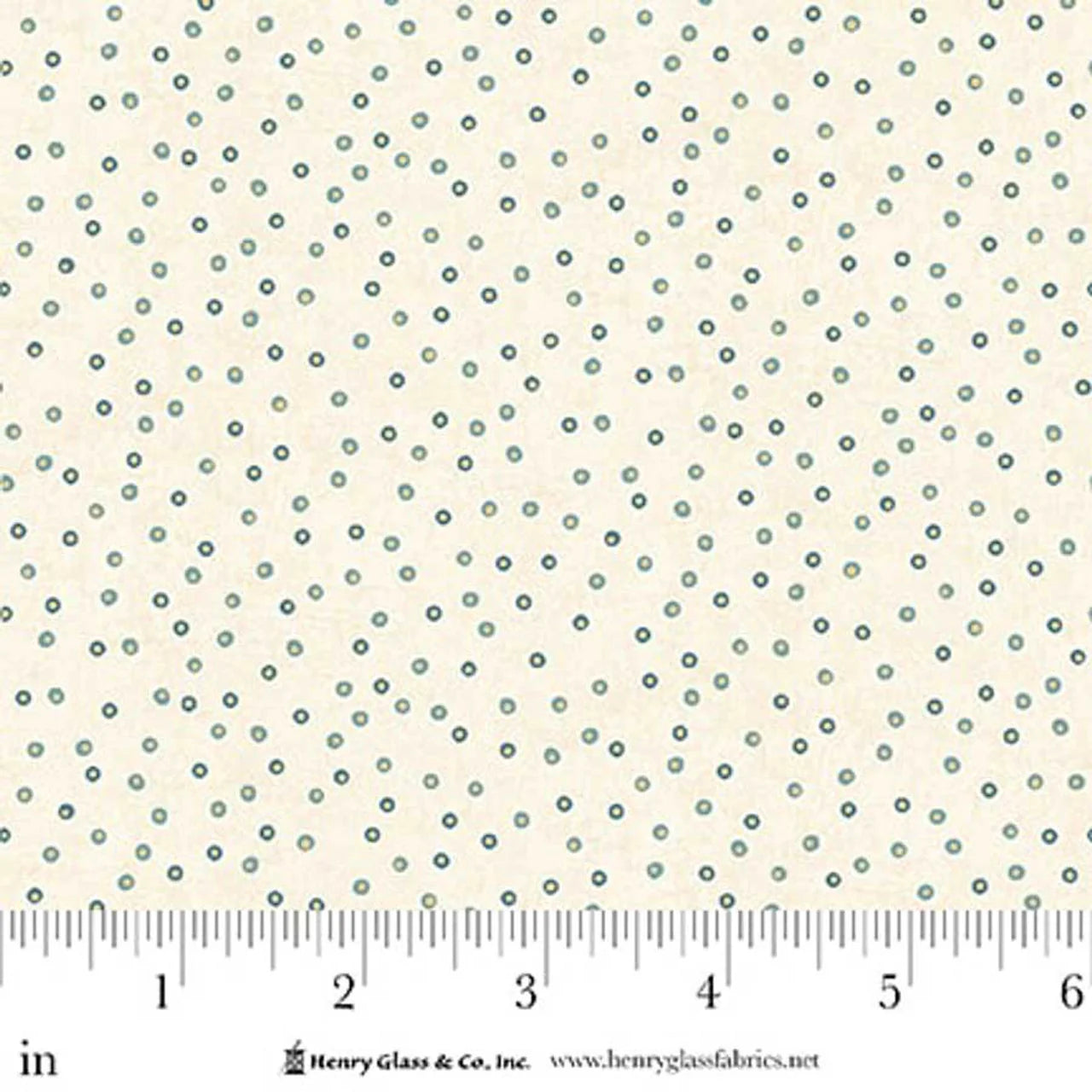 Norwegian Forest Cream Circle Dots Fabric Yardage by Jaftex - Henry Glass Fabrics features small blue and cream circle dots in an even pattern. A ruler below shows inches 0–6, with branding and website under the ruler.