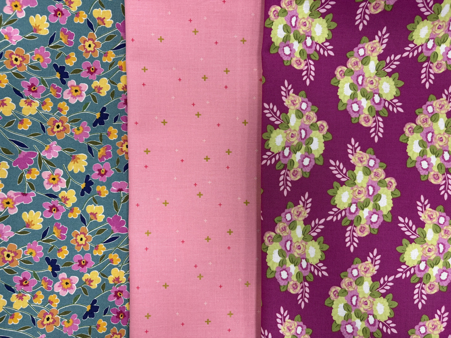 The Morning Meadow Dusk Flower 3 Yard Quilt Top Bundle by Quilted Joy features blue floral, pink cross, and dark purple floral cotton fabrics—perfect for your next quilting project.