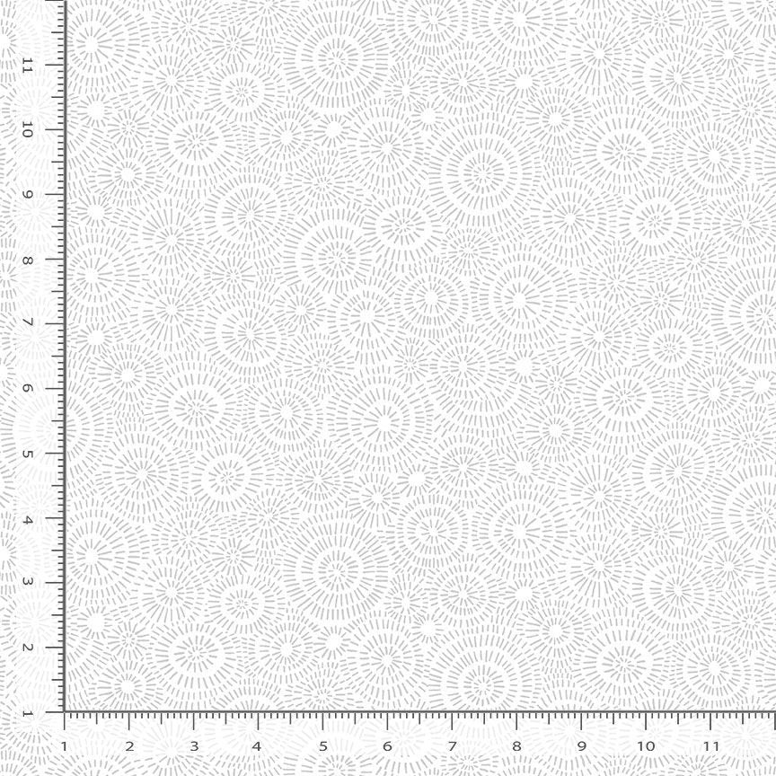 Timeless Treasures Whiteout White Geo Line Circle Shape Fabric Yardage features a subtle circular starburst pattern. A ruler shows inch measurements for scale. This modern, low-volume quilting cotton is ideal for contemporary quilt projects.