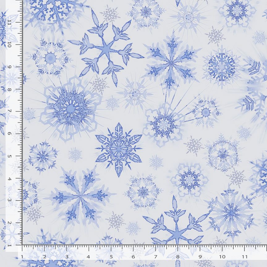 Ice Snowflakes Glitter Frost Metallic Fabric by Timeless Treasures features shimmering blue snowflakes on a white background. A 12-inch ruler shows the scale, making it perfect for adding frosty elegance to your winter projects.