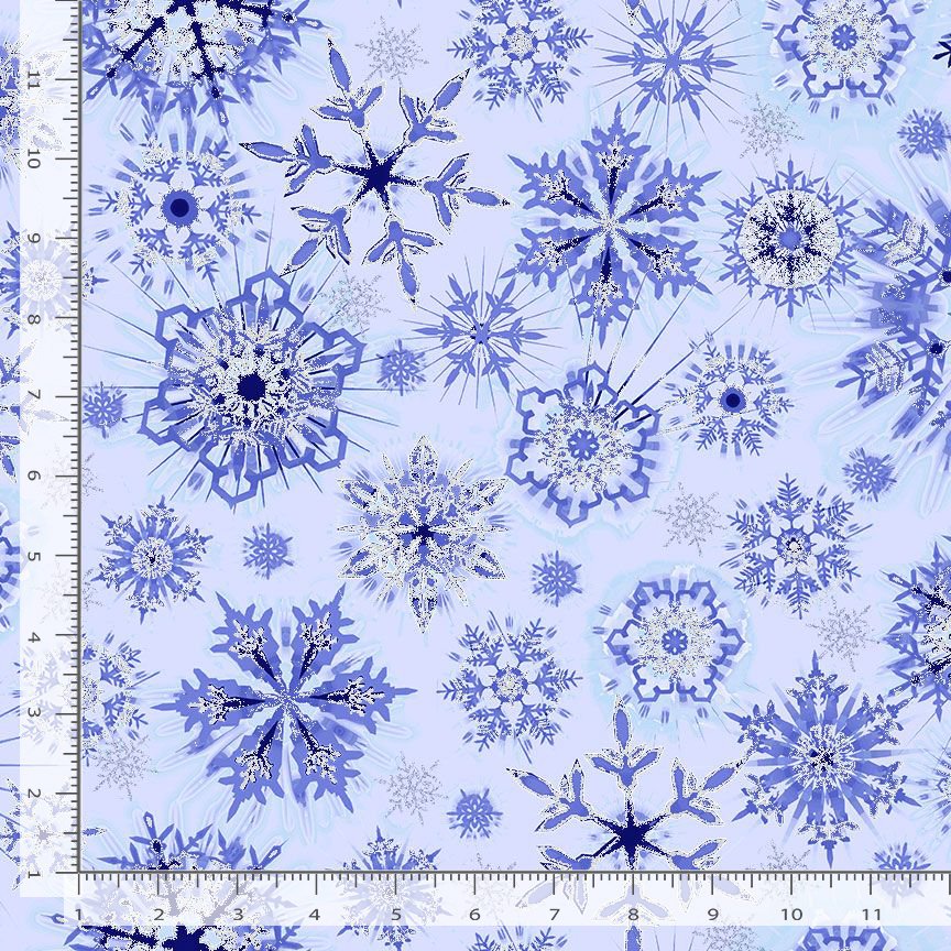 Ice Sky Snowflakes Glitter Frost Metallic Fabric Yardage by Timeless Treasures features blue snowflake patterns on a light blue background, with white inch rulers along the left and bottom edges to show scale—ideal for winter projects.