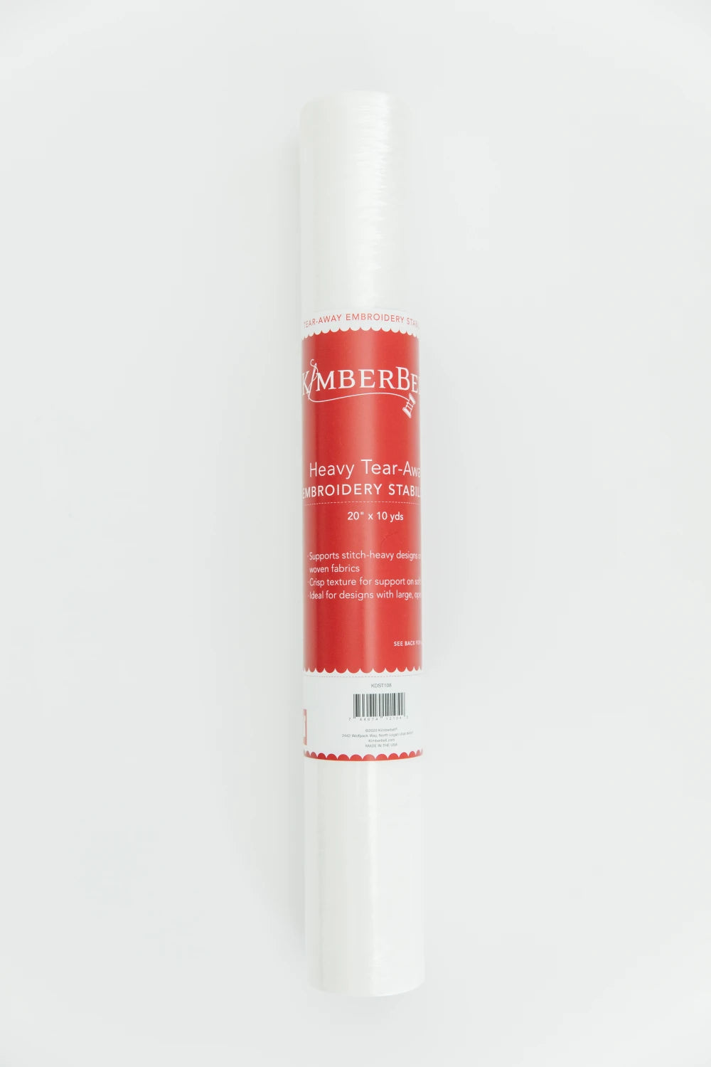 The Kimberbell Heavy Tear-Away Embroidery Stabilizer 20in x 10yd by Checker Distributor stands upright against a white background, showing its red and white label, ideal for supporting stitch-heavy embroidery designs.