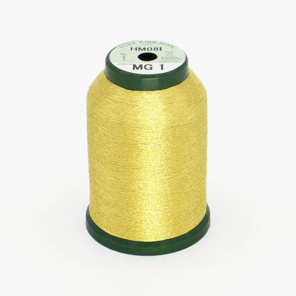 A spool of DIME Embroidery KingStar Thread Metallic Gold 2 MG1, 1000 meters, featuring yellow-gold metallic thread with a green base and top, is shown against a white background.