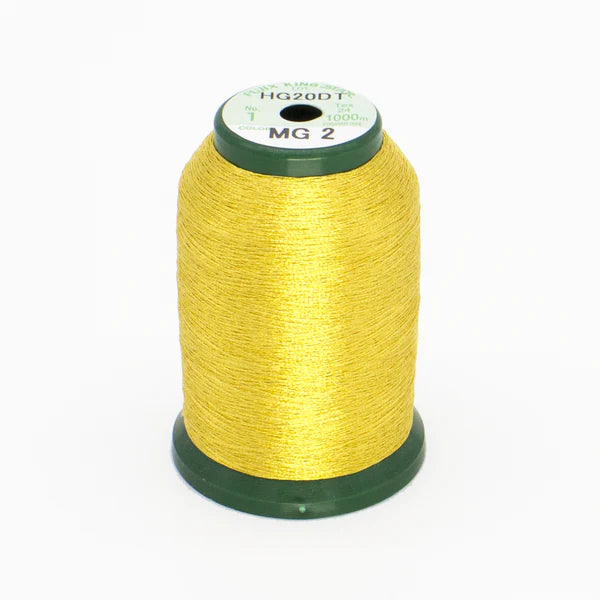 A large spool of DIME Embroidery KingStar Thread Metallic Gold 3 MG2, 1000 meters, with green plastic ends stands upright on a white background. The top label reads HG20DT and MG 2.