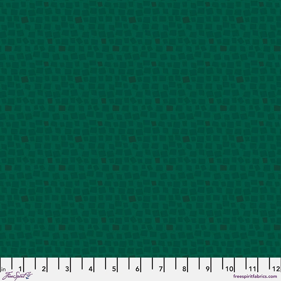 Chromatics Pine Stepping Stones Fabric Yardage by Jaftex - FreeSpirit features a dark green design with light green, irregular squares. A white ruler (inches 1–12) lines the bottom edge. Designer and website appear in the corners.