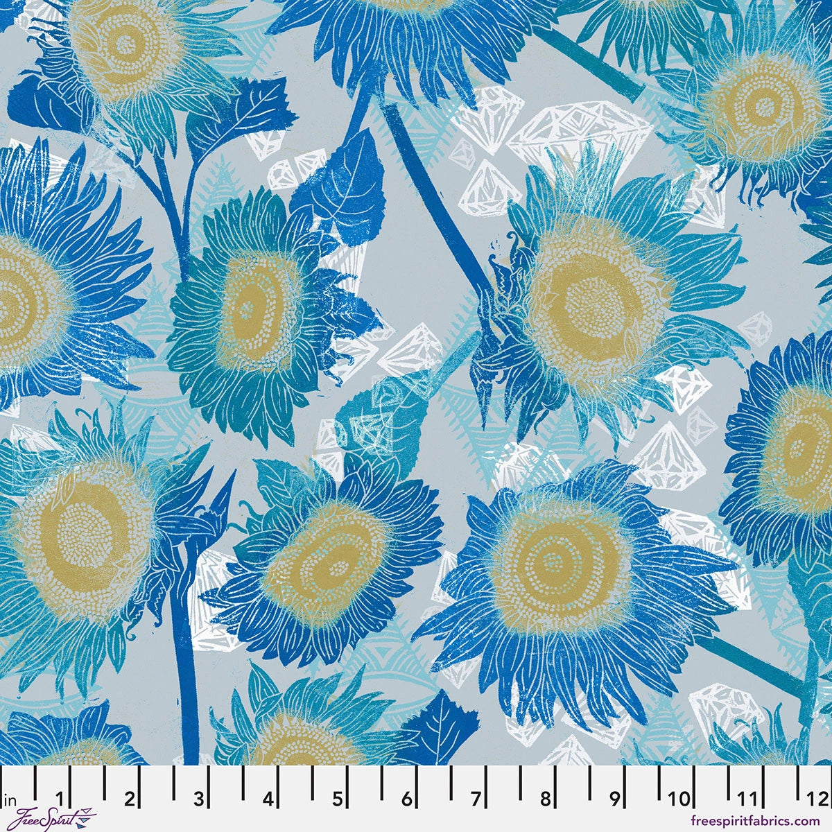 The Wisdom Cool The Sunflowers Fabric Yardage by Jaftex - FreeSpirit features large blue and yellow sunflowers with green stems on a light blue patterned background. Ideal quilting cotton, shown with a ruler in inches along the bottom.