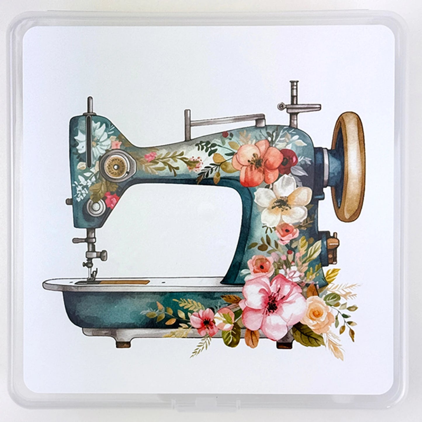 An illustration of a vintage sewing machine with vibrant floral designs, ideal for enhancing your sewing space or displaying with the Summit Street Storage Box - My Bestie by Checker Distributor, set on a plain white background.