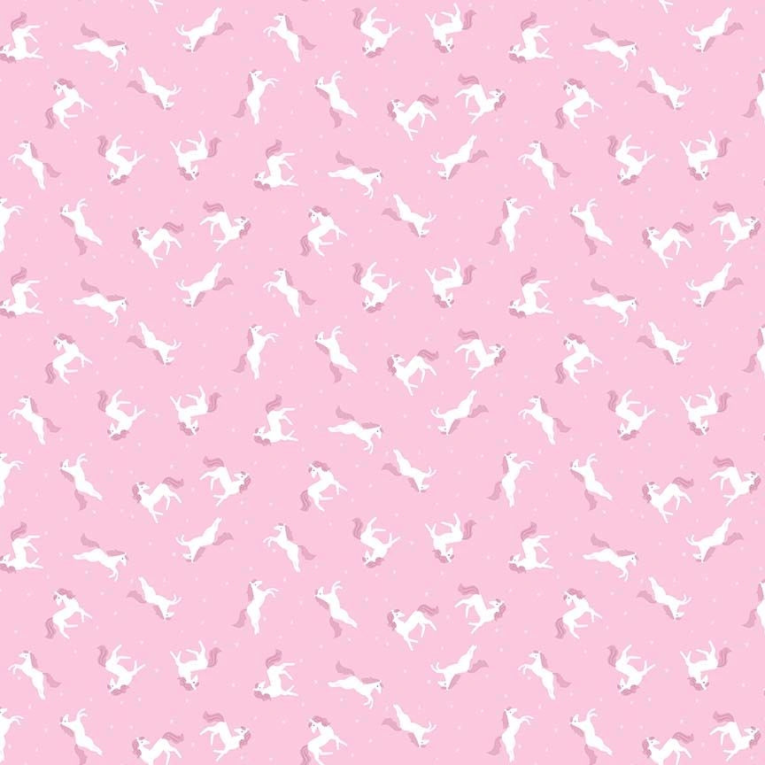 Enchanted Pink My Little Pony Fabric Yardage by Dear Stella features playful white unicorns with pink manes and tails on a light pink background—ideal for nursery décor or whimsical quilting projects.