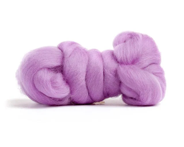 Merino Wool Top Roving Lilac is coiled neatly on a white background—soft, fluffy, and perfect for fiber creations or delicate crafting projects.