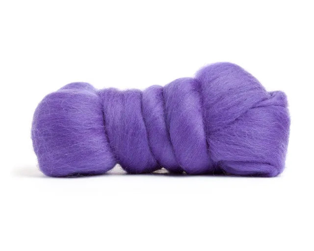 A bundle of Merino Wool Top Roving in violet purple is rolled up and displayed on a white background—ideal for all your fiber creations.