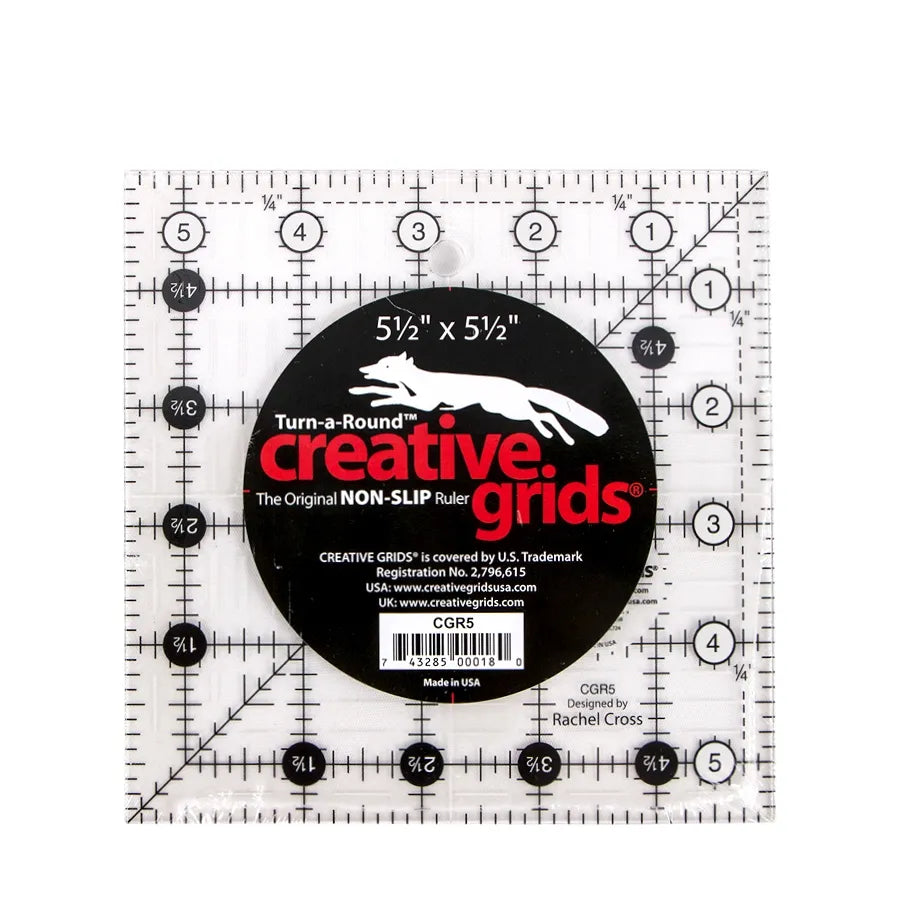 The Checker Distributor Creative Grids 5.5" Quilting Square Ruler offers non-slip acrylic, clear grid lines, black and white markings, numbers, and a central black label—ideal for accurate quilting projects.