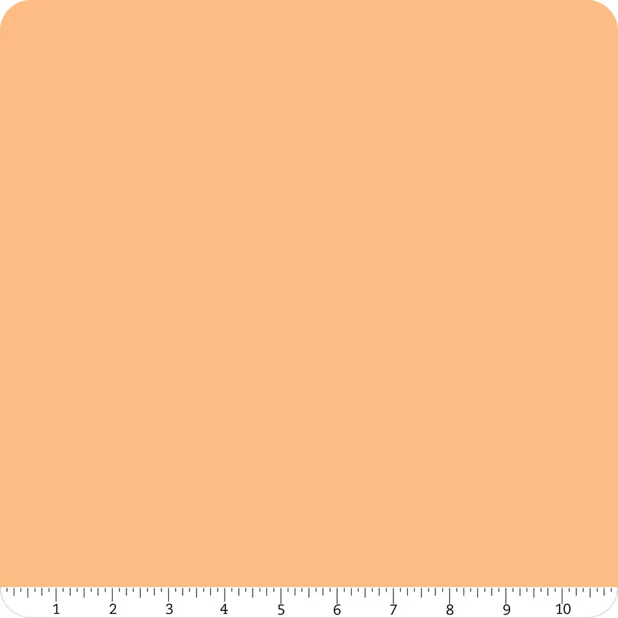 A square swatch of Riley Blake Confetti Cotton™ Marmalade Solid Fabric Yardage with rounded corners is shown, featuring a ruler along the bottom edge measuring inches 1 to 11.