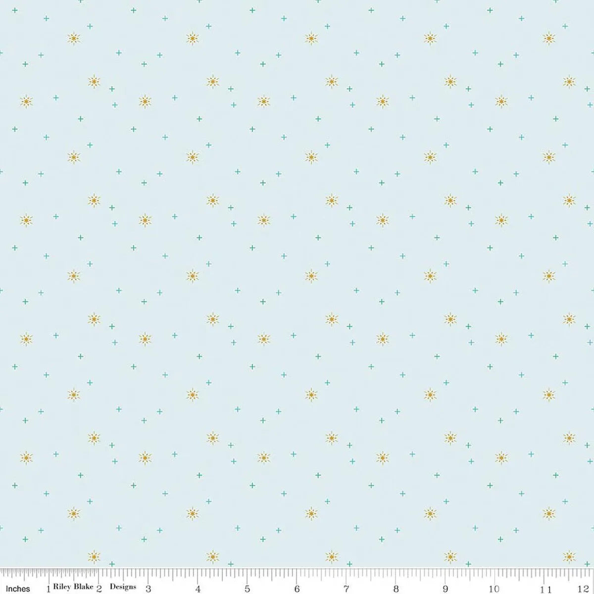 Riley Blake’s Sparkler Iceberg Snowflake Fabric features a light blue background with small yellow suns and aqua plus signs. A ruler along the bottom edge (0–12 inches) makes it ideal for Christmas quilts or festive sewing projects.