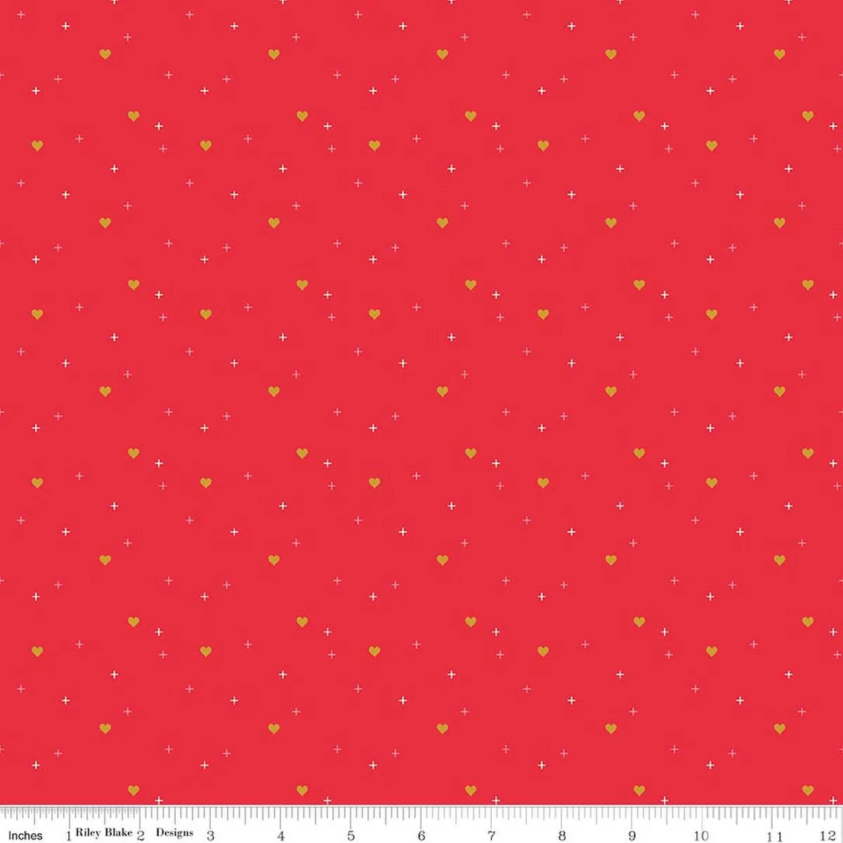 Sparkler Riley Red Heart Fabric Yardage by Riley Blake displays scattered small yellow hearts and white plus signs on a bright pink background. An inch ruler at the bottom shows the evenly repeating pattern’s scale.