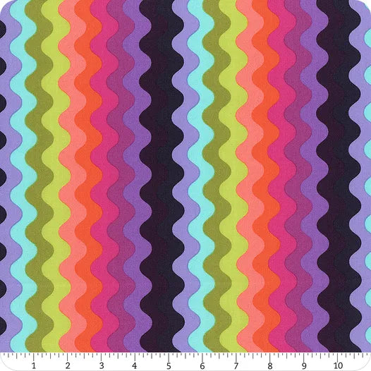 Colorful wavy rainbow stripes run vertically across the Floral Reef Deep Dive Wave Rider Fabric Yardage by Jaftex - FreeSpirit, shown with a ruler (0–10 inches) for scale.