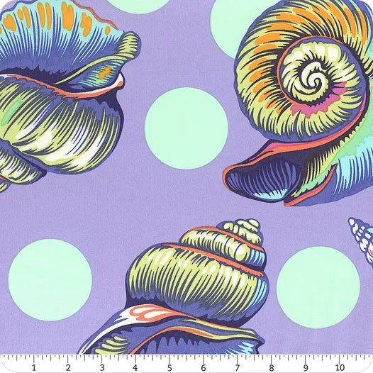 Floral Reef Marine Big Shelly 108" wide quilt backing fabric by Jaftex - FreeSpirit features colorful, illustrated seashells on a lavender background with light green polka dots, perfect for coastal quilts. Ruler shown for scale.