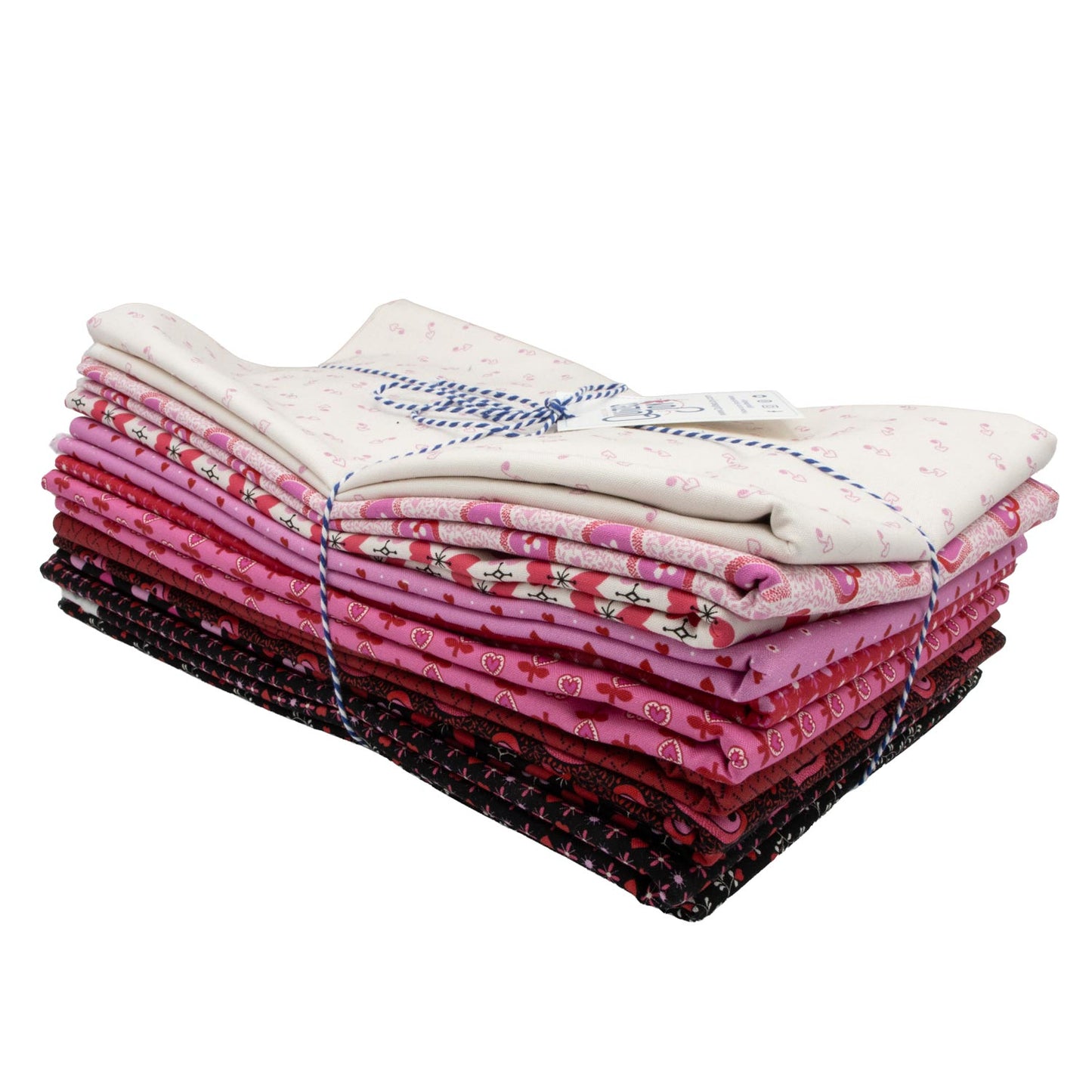 The Andover Heart and Soul One Yard Bundle features neatly folded fabric squares in pinks, creams, and dark shades, tied with blue and white string. Each unique small-patterned fabric comes in convenient one-yard cuts.