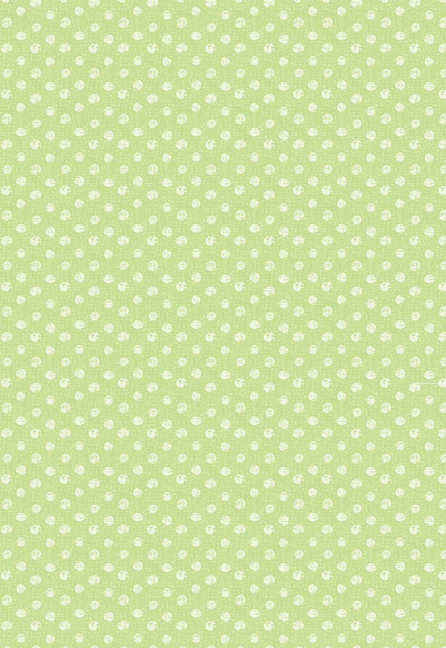 Textured Dots Green Fabric Yardage features a light green background with small white polka dots in a repeating pattern, offering a soft, decorative look perfect for various fabric projects.