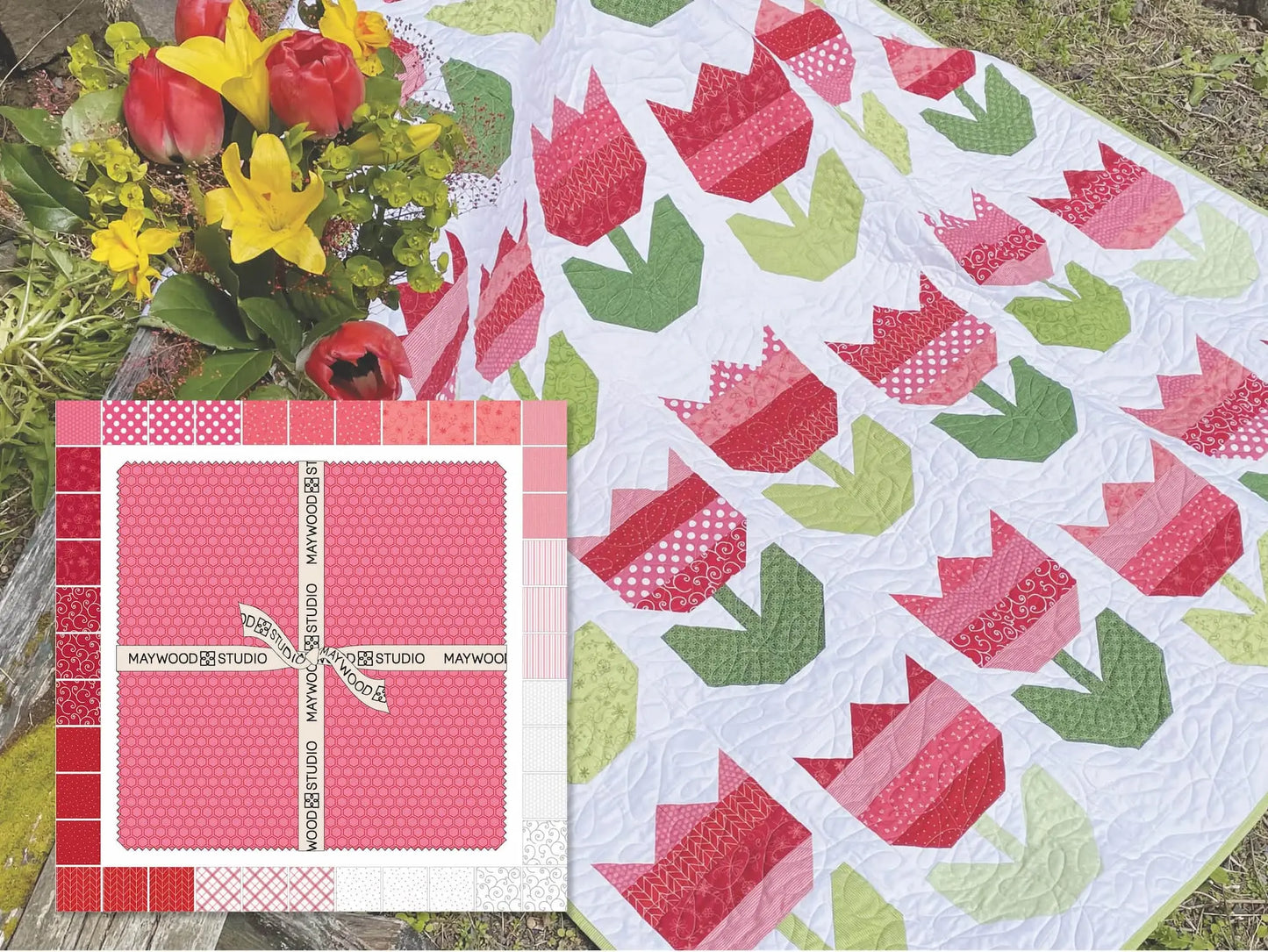 A vibrant Kimberbell Tulips Quilt Kit in red, pink, and green sits beside a bouquet of red and yellow flowers, with a Maywood Studio Be Mine pink fabric layer cake bundle in the corner.