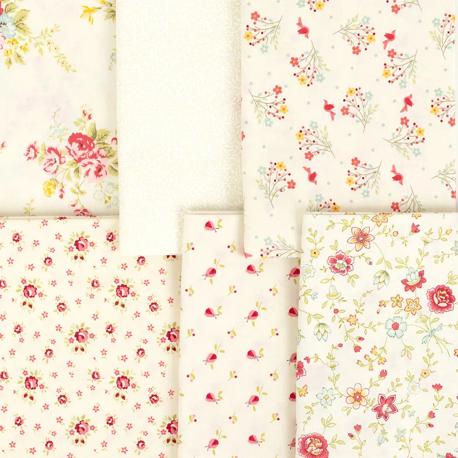 Six Lyda Rose Mini Charms by United Notions, each in unique pastel floral prints, are arranged in a grid. Patterns feature small flowers and larger bouquets in pink, red, yellow, and green.