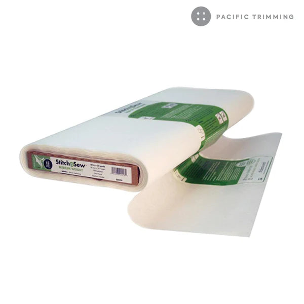 A bolt of Stitch N' Sew Tear-Away Medium Weight Stabilizer by Checker Distributor, 20in wide with a green and white label, partially unrolled on a white background featuring the Pacific Trimming logo in the top right corner.