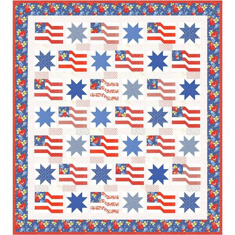 The Rosie Quilt Kit by United Notions features blue stars and red-and-white flag blocks with blue star fields in Rosie fabric, bordered by a blue floral pattern for a classic Americana look.