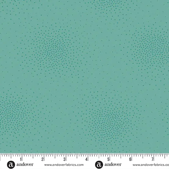 Spritz Hummingbird Fabric Yardage by Andover features teal quilting fabric with scattered clusters of small, darker teal dots. An inch ruler for scale is shown—perfect for your next project.
