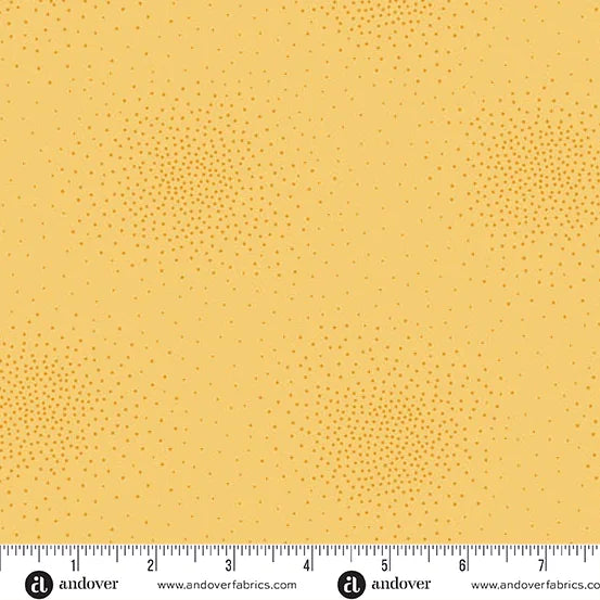 Spritz Butter Fabric Yardage by Andover features a subtle yellow dotted pattern and a white 1–10" ruler with brand marks at the bottom—ideal for quilting projects.