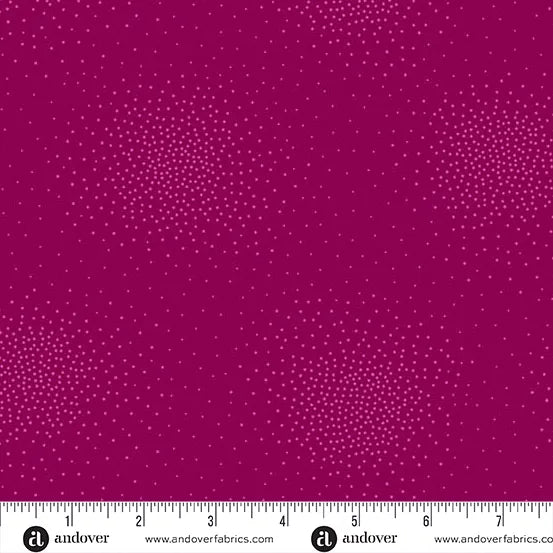 Spritz Fuchsia Fabric Yardage by Andover features deep magenta quilting cotton with clusters of small light pink dots in starburst patterns. A white Andover-branded ruler shown at the bottom indicates scale in inches.