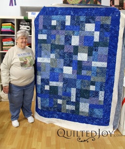 Luscious blue batik fabrics in this gorgeous quilt. - QuiltedJoy.com