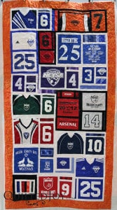 Karee made this soccer jersey quilt for her grandson. Quilter Angela Huffman added a simple meander to finish the quilting. - QuiltedJoy.com
