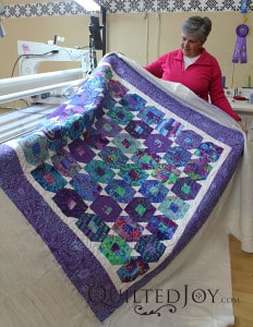 This beautiful purple and blue quilt is a wedding gift.