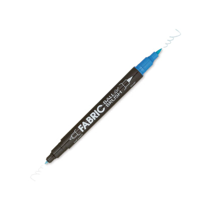 The Marvy Fabric Ball & Brush Marker by United Notions is a double-ended marker with a black body and blue caps that creates light blue wavy lines from both ends on white fabric.
