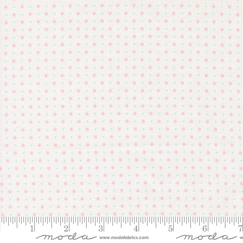 Abide Linen White Dots Fabric Yardage by United Notions is a 100% cotton quilting fabric with small, evenly spaced pink polka dots and inch markings from 1 to 8. Ideal for polka dot quilt projects.