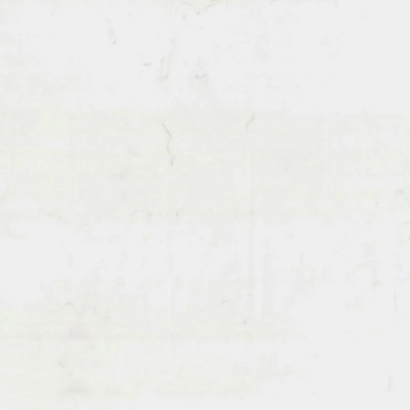 The 1895 Watercolors Snow Batik Fabric Yardage by Hoffman Fabrics features a white, subtly textured surface with faint gray smudges and gentle marks, evoking the look of softly weathered watercolor or worn cotton.