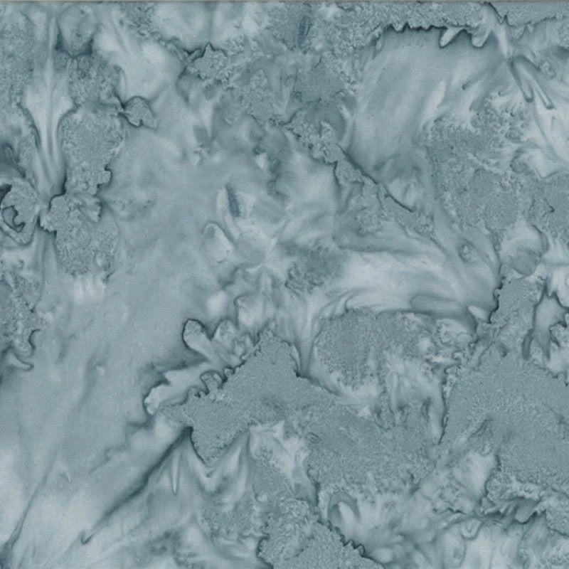 Featuring a swirling gray and blue marbled pattern, 1895 Watercolors December Batik Fabric Yardage by Hoffman Fabrics is perfect for quilt lovers seeking stunning, textured designs reminiscent of abstract clouds or frost.