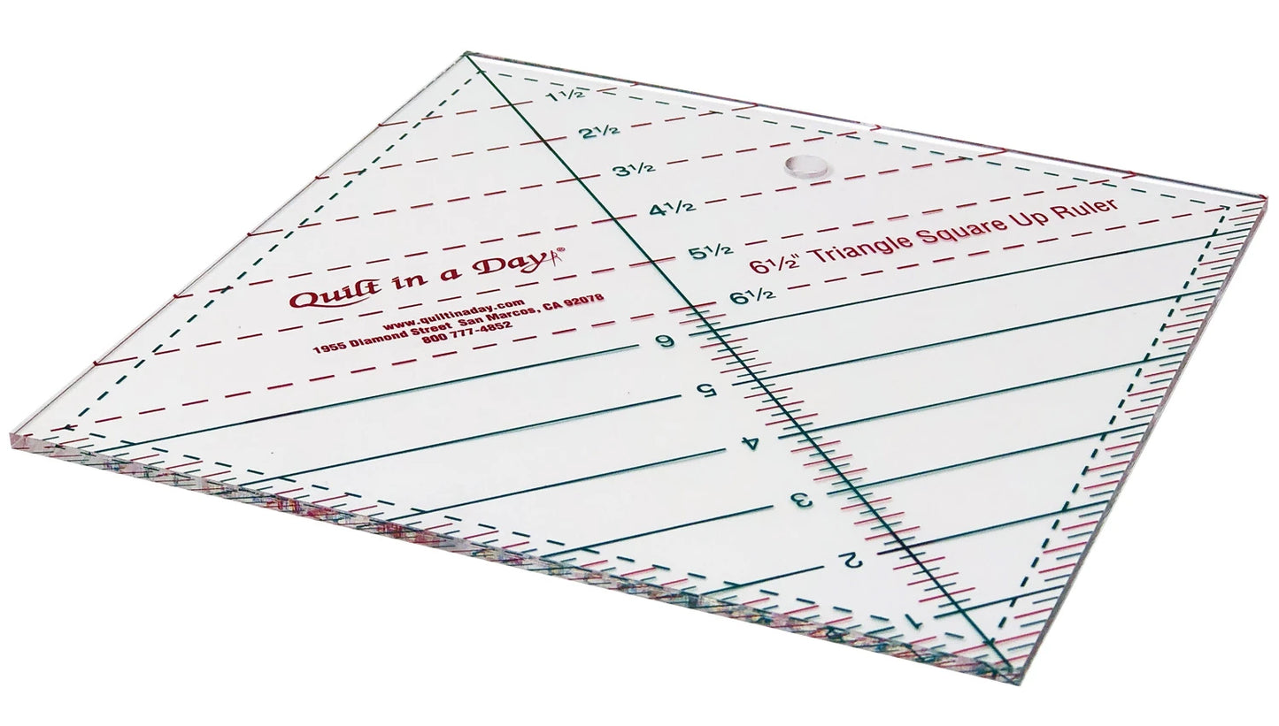 A clear, square Triangle Square Up Ruler 6-1/2in by Checker Distributor, featuring diagonal lines for cutting half-triangle squares and accurate measurements, shown on a white background.